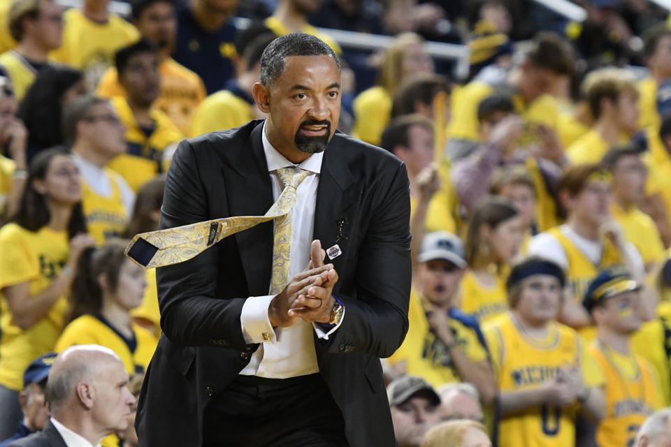 Juwan Howard grabs Wisconsin assistant Joe Krabbenhoft