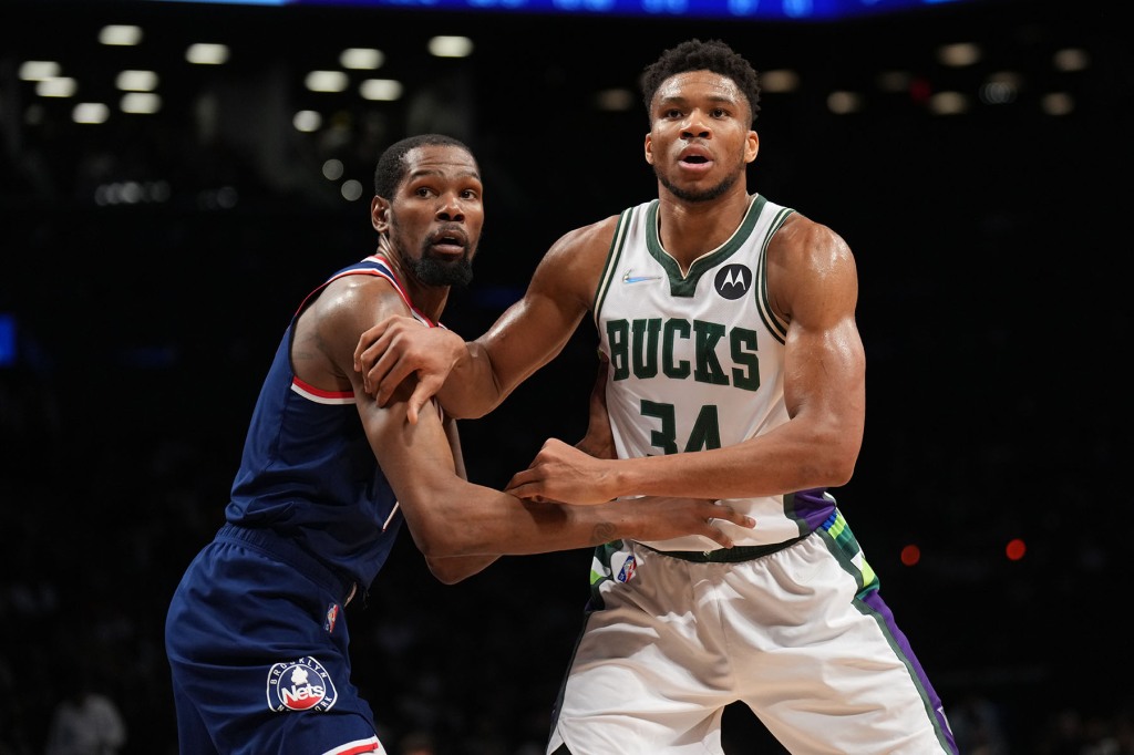 Kevin Durant #7 of the Brooklyn Nets and Giannis Antetokounmpo #34 of the Milwaukee Bucks fight for position during a game on March 31, 2022 at Barclays Center in Brooklyn, New York.