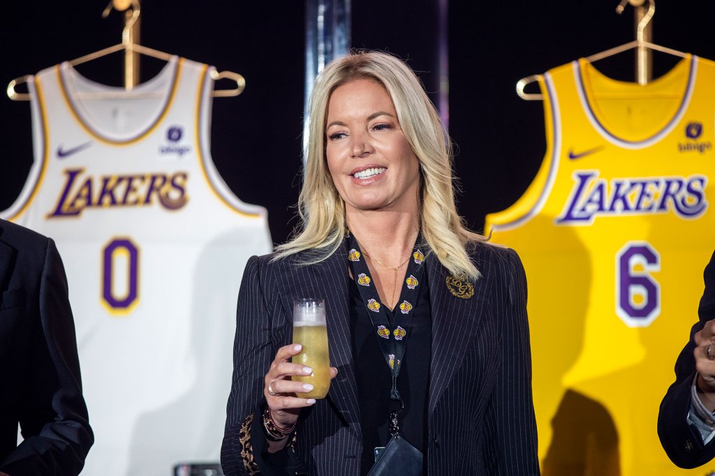 Jeanie Buss, CEO / Governor / Co-owner of the Los Angeles Lakers, holds a new Lakers jersey as the Lakers