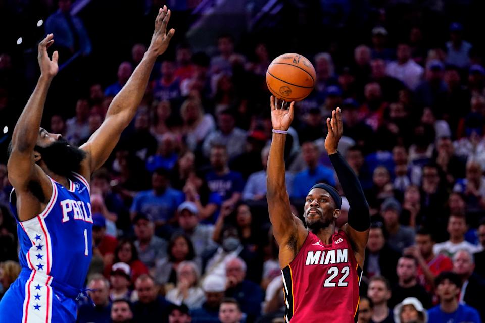 Miami Heat's Jimmy Butler, right, goes up for a shot against Philadelphia 76ers' James Harden during the first half of Game 6 of an NBA basketball second-round playoff series, Thursday, May 12, 2022, in Philadelphia. (AP Photo/Matt Slocum)