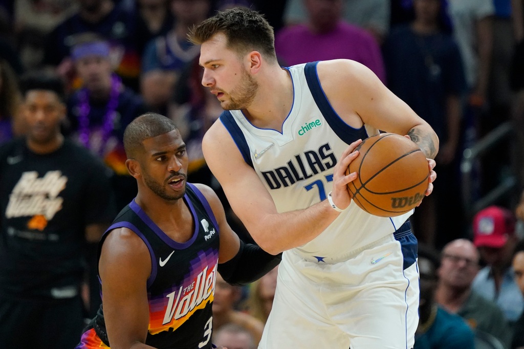 The Mavericks' Luka Doncic (r.) and the Suns' Chris Paul (l.) during Game 7 of the second round of the NBA playoffs on Sunday.