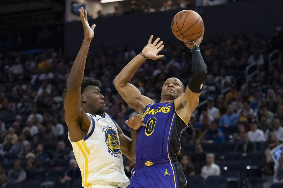 Los Angeles Lakers guard Russell Westbrook shoots the basketball against Golden State Warriors center James Wiseman during the third quarter of the season opener at Chase Center in San Francisco on Oct. 18, 2022. (Kyle Terada/USA TODAY Sports)