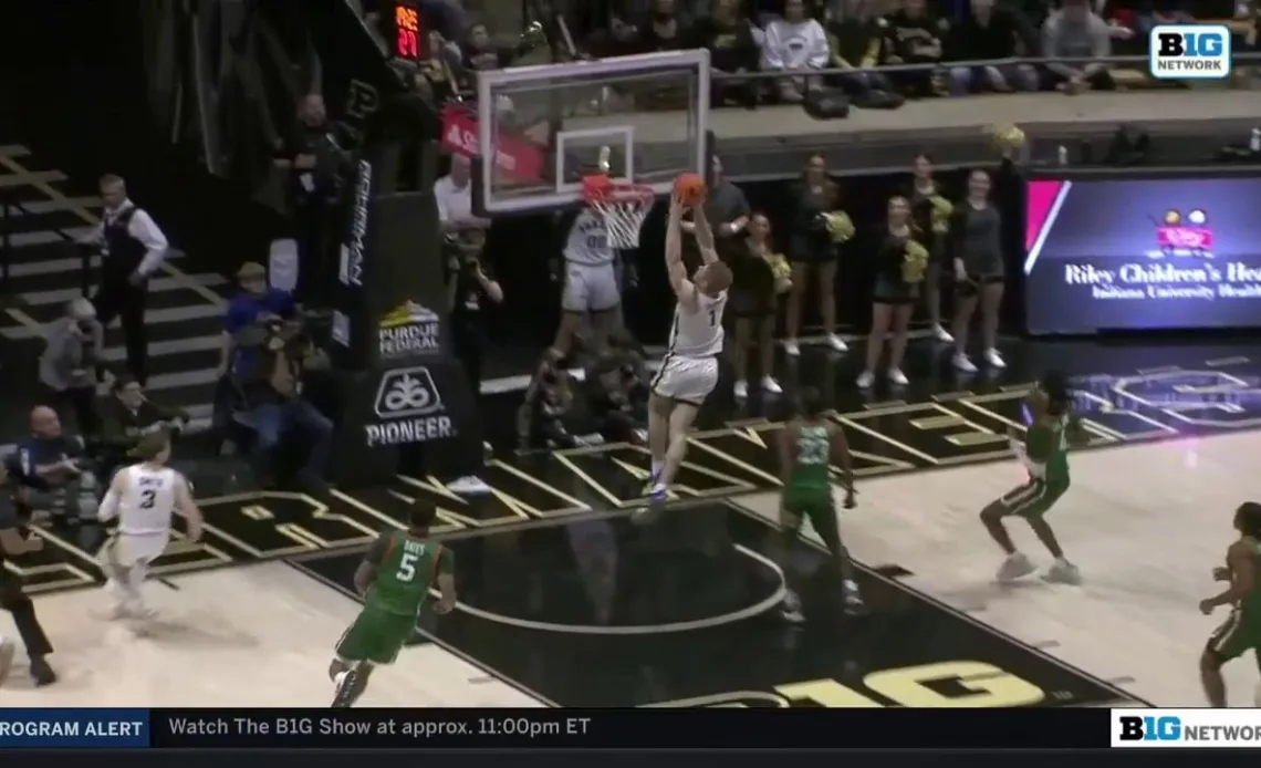 Purdue's Caleb Furst slams home a running two-handed dunk to extend the Boilermakers' lead