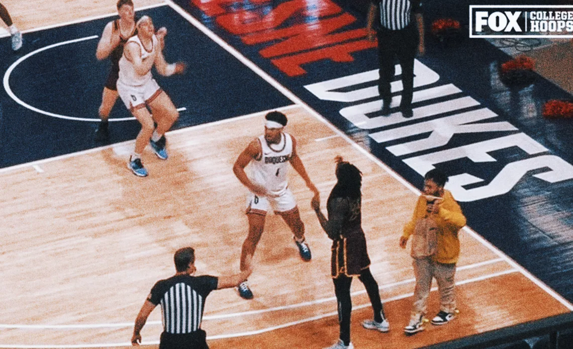 Food delivery guy walks onto court in middle of college basketball game