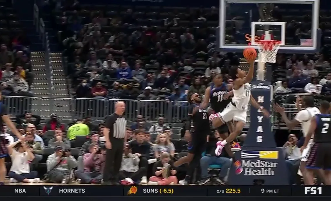 Jordan Riley makes a layup with an acrobatic finish for Georgetown to extend their lead over Depaul