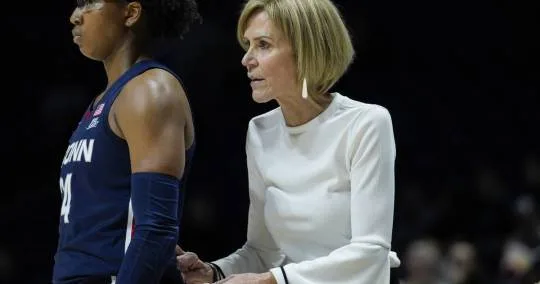 UConn players all behind Chris Dailey as she continues to fill in for Geno Auriemma
