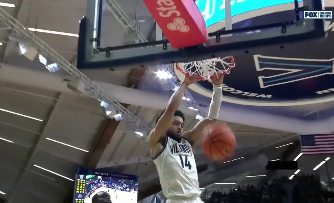 Villanova's Caleb Daniels maneuvers past the defense and throws down a wicked two-handed slam to even the score