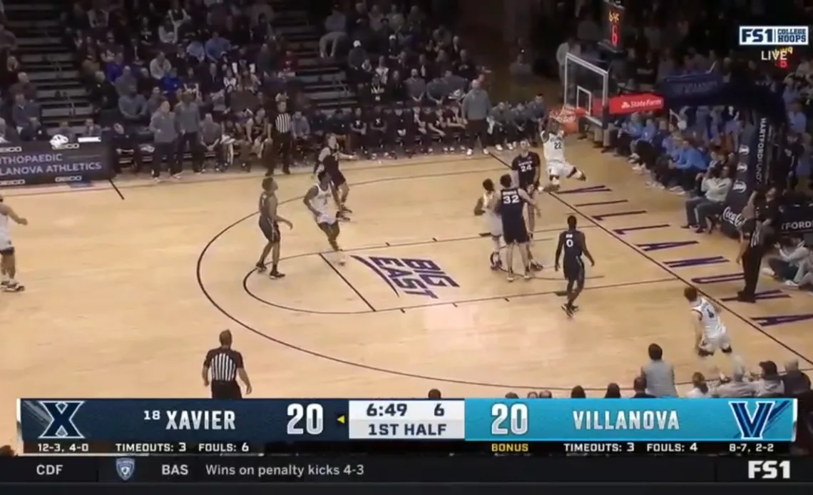 Villanova's Cam Whitmore rips the rim to take the lead