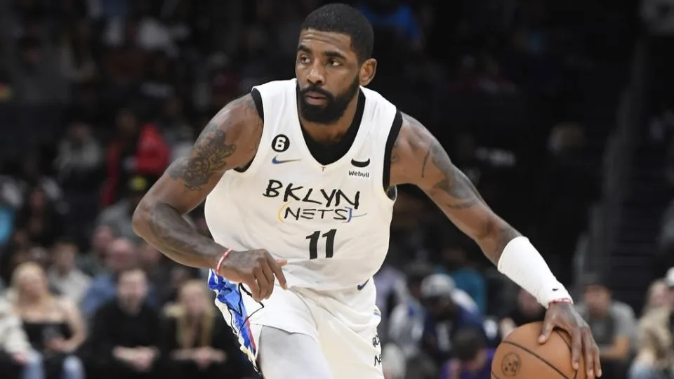 Dec 31, 2022; Charlotte, North Carolina, USA; Brooklyn Nets guard Kyrie Irving (11) brings the ball up court against the Charlotte Hornets during the first half at the Spectrum Center.
