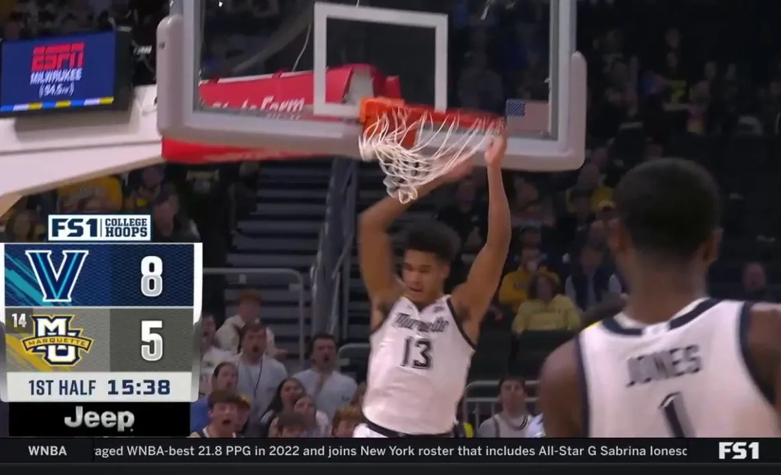 Marquette's Oso Ighodaro throws down a huge alley-oop dunk to trim into Villanova's lead