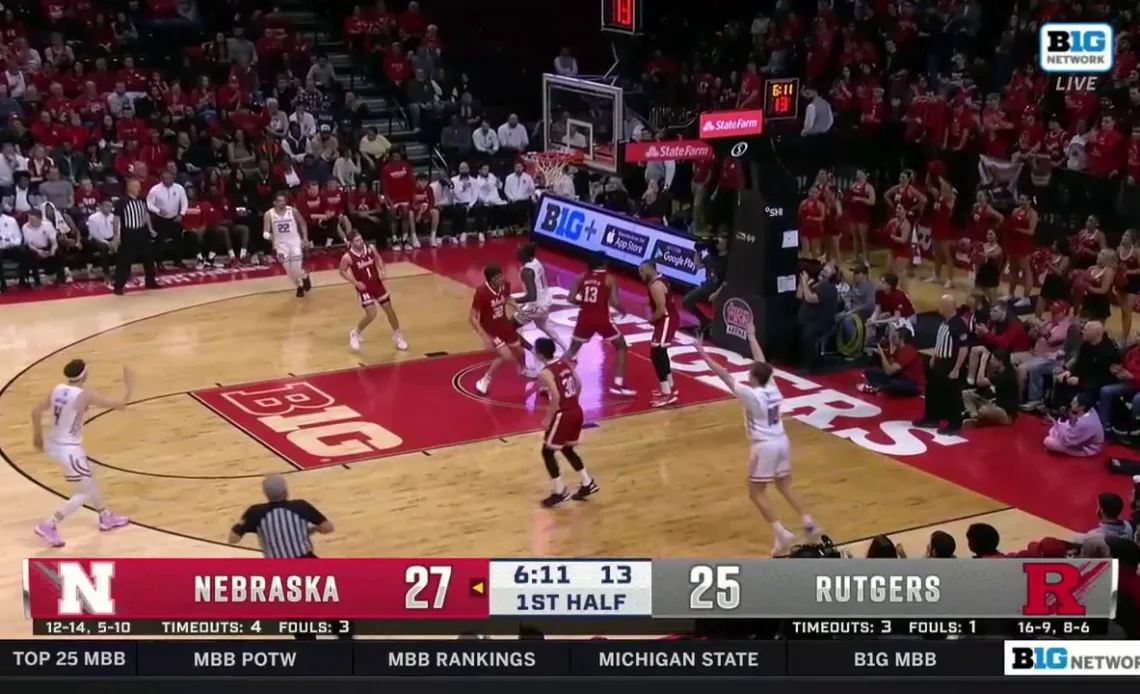 Rutgers' Clifford Omoruyi throws down a one-handed dunk from underneath the rim against Nebraska