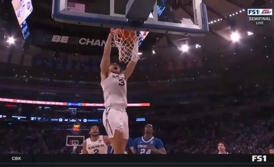 Xavier's Colby Jones flies by Creighton's defense for a two-handed slam