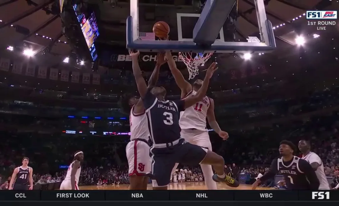 St. John's Joel Soriano tips Butler's Chuck Harris' layup to prevent a basket