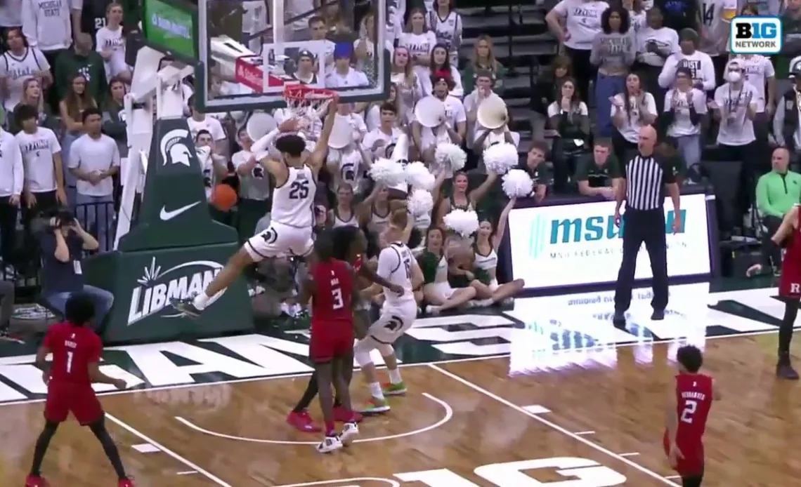 Malik Hall throws down the two-handed dunk to help Michigan State increase the lead over Rutgers