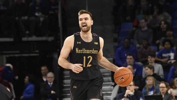 Northwestern guard Pat Spencer (12) plays against DePaul during the first half of an NCAA college basketball game, Saturday, Dec. 21, 2019, in Chicago. (AP Photo/David Banks)