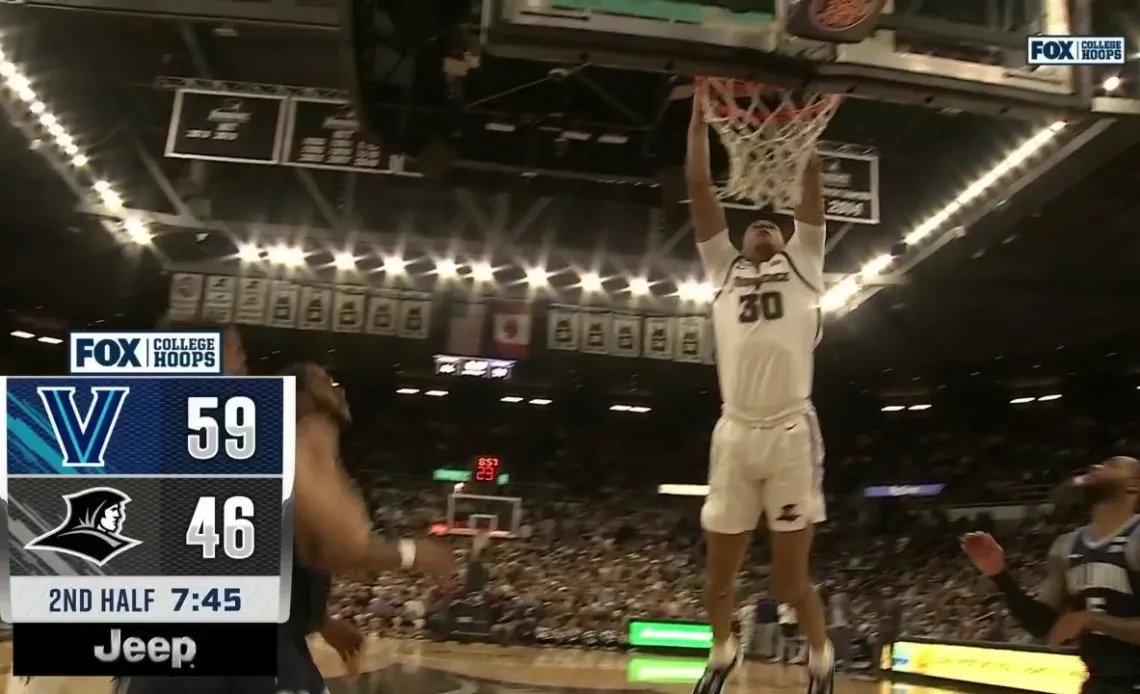 Providence's Rafael Castro skies for a ferocious alley-oop against Villanova